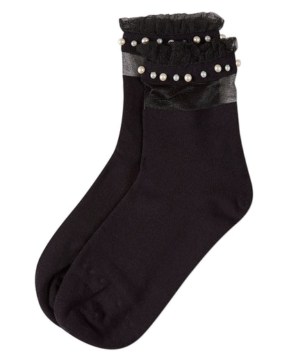 Black sock with pearl embellishments on a white background