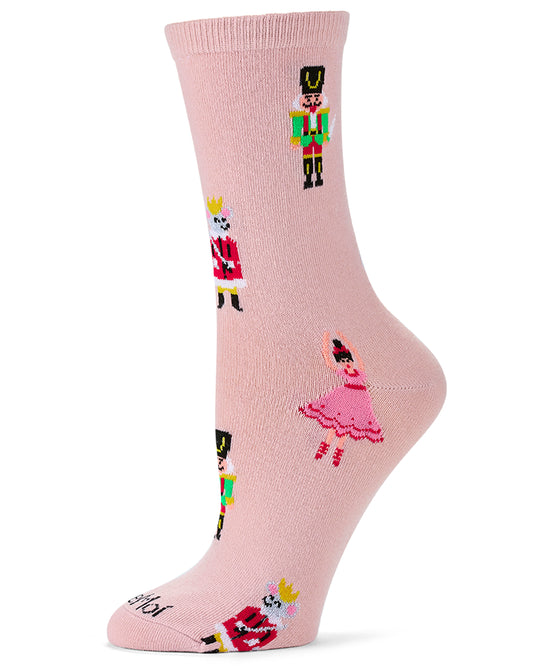 A single light pink crew sock with a knit pattern of cartoon toy soldiers, a ballerina, and a crowned king, shown on a white background.