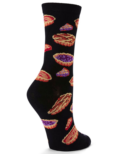 A single black crew sock with a repeating pattern of colorful pies and pastries, shown on a white background.