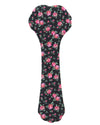 A bone-shaped dog toy or chew cover featuring a black background with a pink and red floral pattern and green leaves, shown on a plain white background.