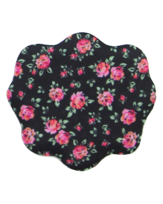 A scalloped-edged fabric accessory, likely a pocket square or small pouch, featuring a black background with a pink and red floral print and green leaves.