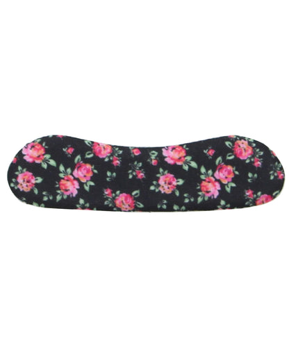 A contoured menstrual cup with a black background and a vibrant pink and red floral pattern with green leaves, shown against a plain white background.
