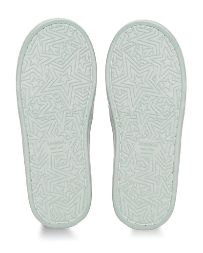 The soles of a pair of shoes shown from the bottom, featuring a light mint green color with an embossed geometric star pattern and the brand name 'MAMOO' printed near the heel.