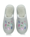 A pair of light gray ribbed slip-on slippers with a soft white fleece lining and colorful embroidered motifs including books, flowers, bows, and butterflies on the top.