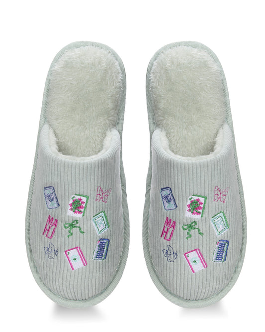 A pair of light gray ribbed slip-on slippers with a soft white fleece lining and colorful embroidered motifs including books, flowers, bows, and butterflies on the top.