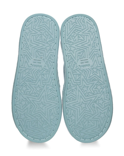 A pair of light blue slip-on slippers shown from the top, featuring a textured geometric star pattern on the soles and visible stitching around the edges.